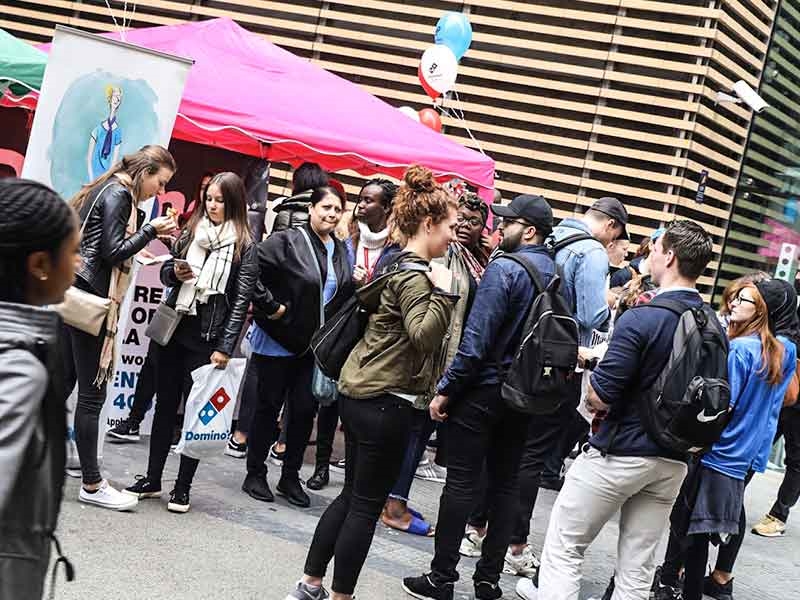 Students attending a freshers fair on campus