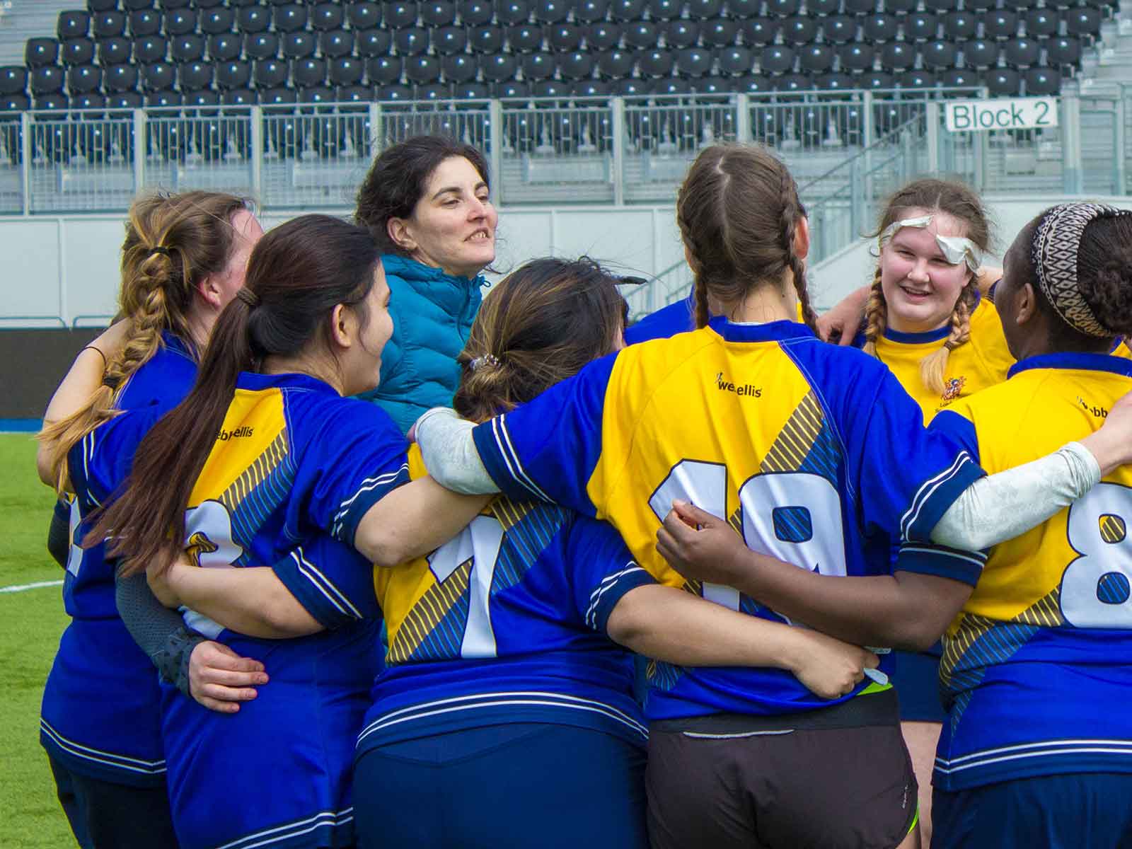 LSBSU's Women's Football team in a team huddle