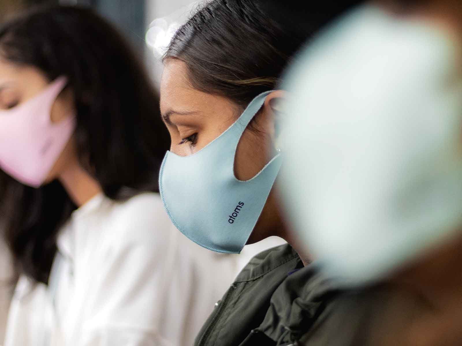Three students wearing masks