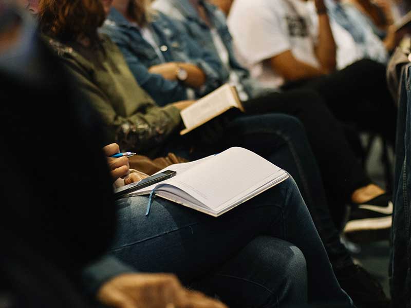 Students in a lecture theatre attending a forum